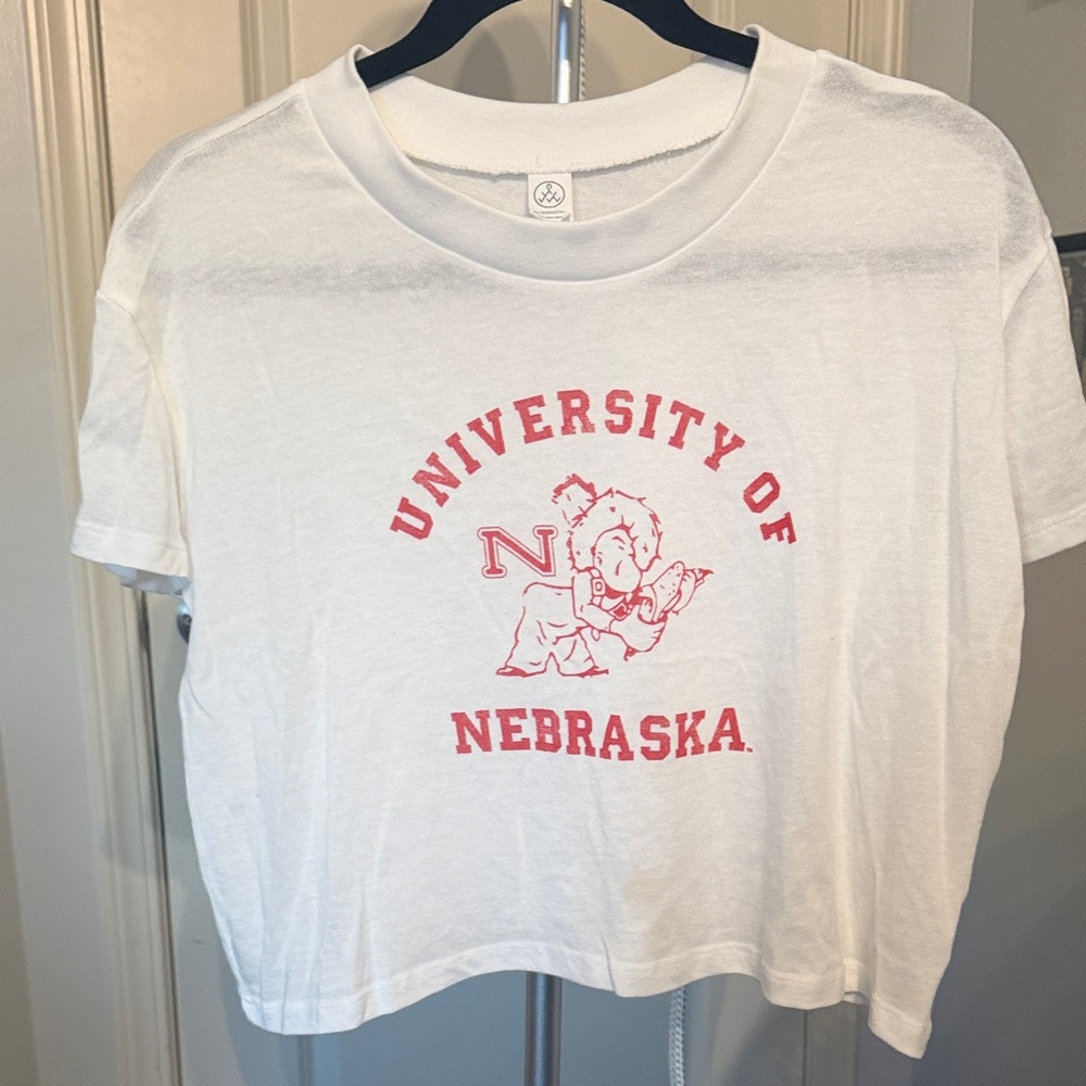 Nebraska White crop top tee.  Does have one small mark at the collar.